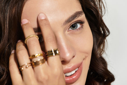 Beauty Shopify theme Beautify. Close-up of a woman's face with one eye covered by her hand.