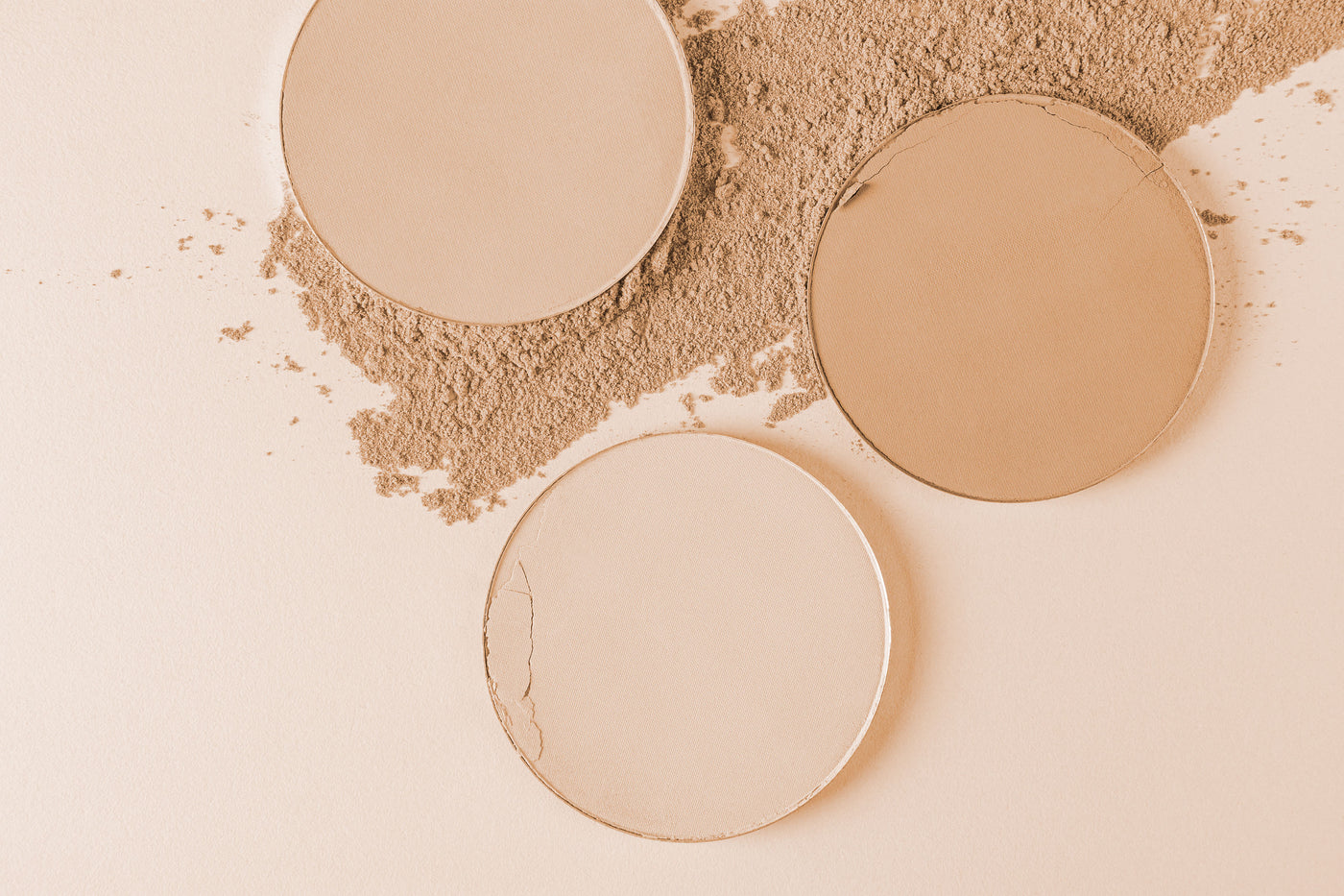 Beauty Shopify Theme Beautify. Three round beige makeup products with powder on a beige background