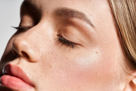 Beauty Shopify theme Beautify. Close-up of a female model's face with a white background.