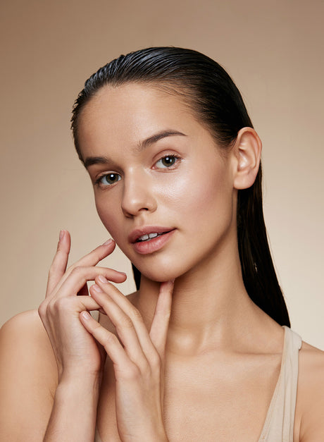 Beauty Shopify Theme Beautify. Woman with a smooth complexion against a beige background