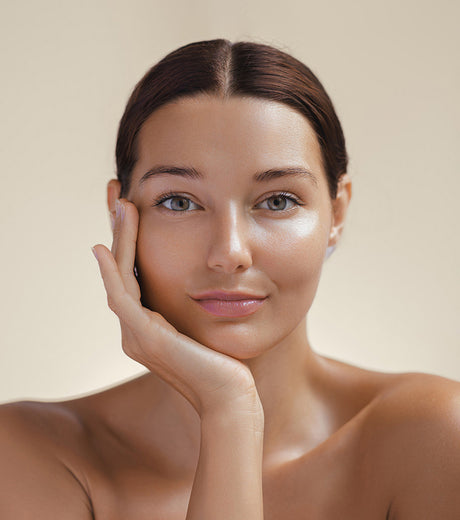 Beauty Shopify Theme Beautify. Woman with smooth skin against a beige background