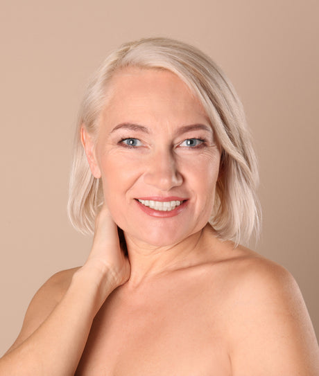 Beauty Shopify Theme Beautify. Woman with blonde hair and clear skin on a beige background