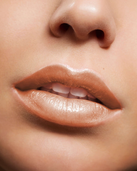 Beauty Shopify Theme Beautify. Close-up of a person's lips with a focus on the lipstick color.