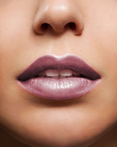 Beauty Shopify Theme Beautify. Close-up of a person's lips with a focus on the lipstick color.