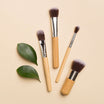 Beauty Shopify Theme Beautify Woman. Set of makeup brushes with wooden handles and green leaves on a beige background